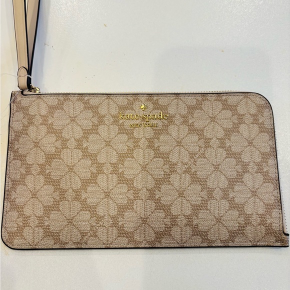 kate spade Handbags - Kate Spade Tan Floral Wristlet in dark beige PVC material Mint condition